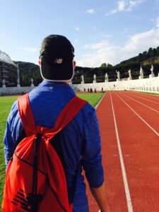 Therapist Brant Stachel, walking on the Olympic track in Rome, Italy.